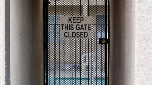 Aluminum pool fence with a self-closing gate in Edina, MN